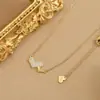 Chapado en oro real temperamento de alta calidad cadena para la clavícula diseño de nicho femenino sentido del diseño collar de corazón de melocotón collar de moda coreana joyería
