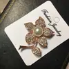 Versión coreana de broche de tulipán de perla de diamante de alta gama, alfiler de moda para mujer, corsage, broche de flor, venta al por mayor, personalizado