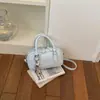 Bolsa de bolos para mujer, nuevo estilo coreano de moda primavera 2026, bolso de mano de alta gama versátil para el hombro y cruzado para el trabajo