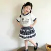 Conjunto de Falda Corta de Verano para Niñas 2026 Nuevo Estilo Moda para Bebé Ropa de Manga Corta Conjunto de Dos Piezas de Dibujos Animados para Niños