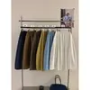SUSAN nueva llegada principios de otoño estilo coreano diseño simple plisado versátil holgado cubre imperfecciones muestra delgado color liso falda midi TW1102
