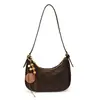 Bolso retro bajo el brazo para mujer, nuevo y versátil bolso de hombro y cruzado de alta gama, moderno diseño de nicho, bolso de mujer con forma de media luna