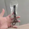 Venta al por mayor de llaveros populares para coche y llaveros de alta gama para motocicleta, perfectos como accesorios decorativos y pequeños regalos para exportación