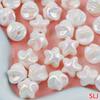 Una variedad de cuentas acrílicas con forma de corazón bañadas en color UV, con diseño de flores de amor y caramelo, accesorios de joyería para hacer tú mismo al por mayor