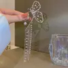 Pendientes de borla de diamante de mariposa súper de hadas para colgar en la oreja pendientes sin perforación para mujer estilo frío clip para el cartílago de la oreja pendientes de celebridad de internet con temperamento