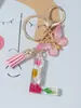 Suministros del Fabricante Llaveros con Flores Secas Prensadas 26 Letras del Alfabeto Inglés Llaveros con Borla de Mariposa Charms para Bolsos de Mujer