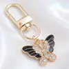 Llavero de Mariposa de Esmalte Blanco y Negro de Gama Alta, Colgante Completo de Diamante, Mariposa Combinada con Colgante de Oro, Llavero DIY, Colgante Pequeño