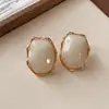 Pendientes de Botón Ovalados de Resina Transfronterizos Europeos y Americanos Pendientes Maillard de Otoño e Invierno Pendientes Simples de Moda Versátiles para Mujer Sensación de Alta Gama