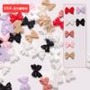 Joyería para uñas de lazo al por mayor explosiones netas rojas simples joyería para uñas de resina cinta tridimensional paquete de colores mixtos 50