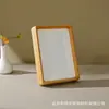 Marco de fotos de madera maciza con ensamblaje de mortaja y espiga, nuevo estilo chino para caligrafía y pintura, soporte de mesa, marco vacío 6 7 8 pulgadas, suministro directo del fabricante de marcos de fotos