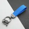 Colgante Llavero de Coche de Cuero Gamuzado Anillo de Resorte de Aleación de Zinc Cubierta de Llave Cadena de Llave con Logo de Coche Venta al por Mayor