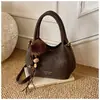 Bolso de Mujer Exquisito y de Moda de Nicho 2025 Nueva Moda Bolso Cruzado Versátil con Cadena con un Toque de Lujo y Bolso de Mano Pequeño