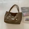 Bolsa de mano de gran capacidad estilo coreano, nueva moda de principios de otoño 2026 y bolso único para mujer, bolsa de alto valor estético para estudiantes