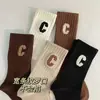 Meias Letra C Femininas Meia-Perna Outono e Inverno Quentes Modernas Celebridade da Internet Roupa Infravermelha Meias de Cano Alto Meias Esportivas Versáteis