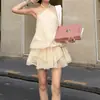 Vestido beige de encaje sin mangas con cuello halter, espalda descubierta, suelto para mujer, nuevo vestido corto de línea A para otoño 2026 con tiras de amarre