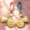 Regalos pequeños y prácticos para el Festival de Medio Otoño: campanilla de conejo rosa, moneda de la fortuna, llavero de pastel de luna, recuerdos promocionales corporativos