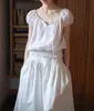 Top de Manga Corta Stamack con Cordones de Encaje de Lino Lavado con Lluvia y Rocío SS2025