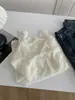 Nueva blusa base de ganchillo de encaje estilo francés para mujer, ligeramente transparente, con cuello alto y mangas largas, adecuada para capas de otoño e invierno