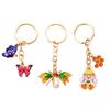 Llavero de aleación con forma de mariposa y abeja, accesorio colgante para bolso de mujer, ideal como regalo de vacaciones para niñas.