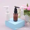 Botella con bomba de loción blanca 35ml botella con bomba de clip transparente botella dispensadora de champú 35ML botella de pico de pato botella de sérum
