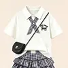 2026 Nuevo Estilo Traje de Verano Dulce de Manga Corta Estilo Universitario para Niñas Traje de Dos Piezas Falda de Pastel Cuadros Elegantes de Dibujos Animados