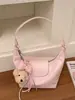 Bolsa de ombro feminina única e estilosa, design de nicho, bolsa casual nova, bolsa de antebraço da moda primavera 2026