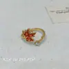 Otoño e Invierno Nuevo Anillo Retro de Zircón Rojo Hoja de Arce para Mujer Dulce Sentido de Alta Gama Exquisito Anillo Abierto Combinable