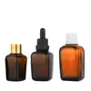 En stock al por mayor botella cuadrada de vidrio ámbar oscuro para aceite esencial de té botella con gotero de aceite esencial botella marrón para esencia