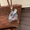 Lindo colgante de bolsa de tela de dibujos animados nuevo con lazo de encaje, decoración de diseño de bolsa de compras, accesorio de mochila al por mayor