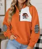 Jaqueta europeia e americana transfronteiriça feminina com blocos de cor e zíper parcial na gola alta, apresentando estampa digital 3D, corte solto estilo street style e propriedades corta-vento.