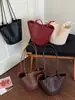 Bolsa de balde tecida com padrão de nicho da moda para mulheres, novo modelo 2026, bolsa de ombro para o dia a dia, bolsa de balde de alta qualidade e grande capacidade