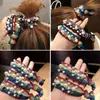 Mismo estilo hecho a mano con cuentas hilo colorido brillante anudado cuerda para el pelo banda de goma alta elástica bolas cuerda para el pelo anillo para el pelo para mujeres