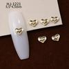 Nuevos accesorios de aleación para decoración de uñas con forma de corazón torcido tridimensional liso con diseño de amor hueco retro japonés