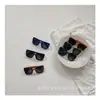 Gafas de sol para niños de la calle fritas de principios de primavera estilo occidental para bebé hombre y mujer forma cóncava para viajar gafas de sol a prueba de sol