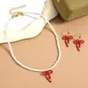 Joyería transfronteriza de San Valentín más vendida Aretes de flor de rosa roja Collar de corazón Conjunto Aretes de San Valentín europeos y americanos
