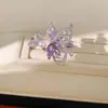 Anillo bañado en oro real de 18k con alas de circón y perla, diseño abierto hueco, sensación de nicho de alta gama, exquisito accesorio de mano