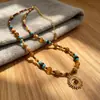 Collar con colgante de girasol y ojo de tigre de estilo étnico de lujo ligero y colorido con cuentas, cadena para la clavícula vintage de nicho estilo vacacional para mujer