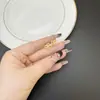 Pendientes Dorados de Arena Vietnamita de Moda Transfronterizos Diamante Cruz Diamante Mortero Pendientes de Trébol de Cuatro Hojas Joyería Exquisita de Larga Duración