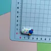 Dibujos animados jugable Denim chico aeroespacial diy funda de teléfono con pegamento de crema hebilla de zapato pasador accesorios de joyería de resina venta al por mayor