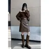 Saia vintage de couro PU de alta qualidade transfronteiriça para mulheres, nova coleção outono 2026, moderna e versátil, elegante saia midi de cintura alta que afina