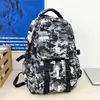 Mochila Camuflada para Homens e Mulheres, Grande Capacidade, Moderna, Leve, Mochila Casual para Viagem, Mochila Escolar para Estudantes Fashion e Versátil