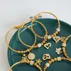 Nueva variedad de colgante de forma estrellas de bebé circón inglés digital pulsera de acero de titanio amor joyería de nicho
