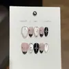 Taoshili [Museo Blanco y Negro] diseña arte de uñas con lunares blancos y negros brillantes, elegante y genial