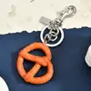 Produto Mais Vendido Transfronteiriço: Pingente de Bolsa em Formato de Pretzel, Design Divertido, Acessório para Bolsa Feminina, Decoração Fofa