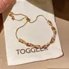 Pulseira pingente geométrico de flor de zircônia cúbica estilo europeu e americano, elegante e versátil, uma peça de joalheria delicada e luxuosa com um toque de alta qualidade, um acessório único e estiloso para mulheres