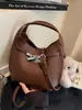 Bolso de mano pequeño de moda con estampado de lichi transfronterizo para mujer, nueva colección 2026, bolso tote para el trabajo, bolso tipo cubo, bolso cruzado moderno y elegante
