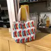 912132 Corea ins pequeño fresco lindo bolsa pequeña de tela mujer arrugada bolso estampado bolsa de almuerzo venta al por mayor