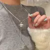 Collar de cadena de cuello largo único de alta gama para mujer con colgante de planeta de perla exquisita de moda de otoño e invierno con borlas