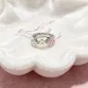 Pendientes de botón con circonita de color en forma de flor de trébol de cuatro hojas, diseño de lujo ligero y de alta gama, estilo nicho, venta al por mayor de pendientes de oro de 14k.