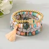 Bestseller transfronterizo estilo bohemio ojo turco borla colgante pulsera multicapa cordón elástico pulsera de cuentas